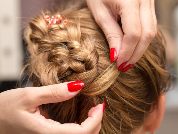 braided pigtails in the beauty salon