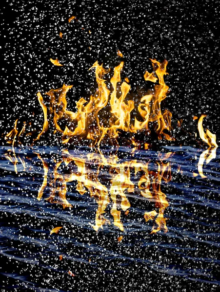 Snow on the fire background with reflection on water — Stock Photo, Image