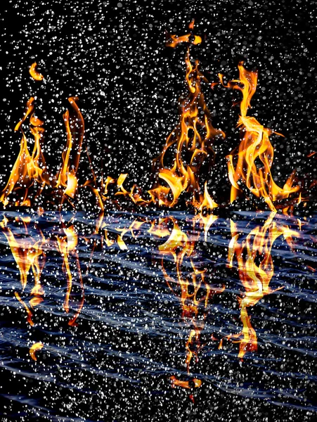 Snow on the fire background with reflection on water — Stock Photo, Image