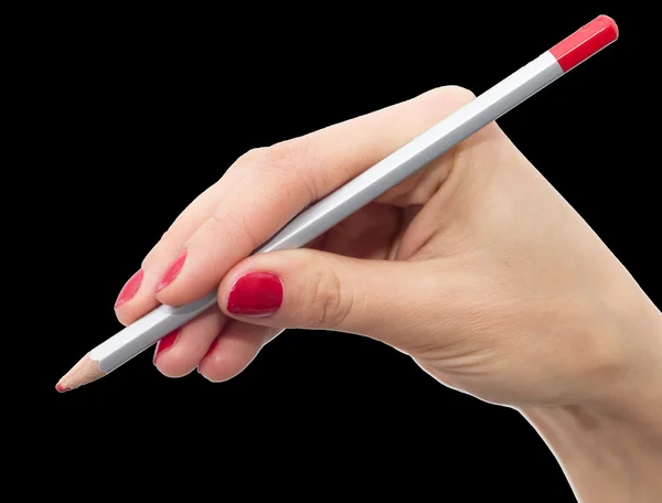 Pencil in hand with red nail polish on a black background — Stock Photo, Image