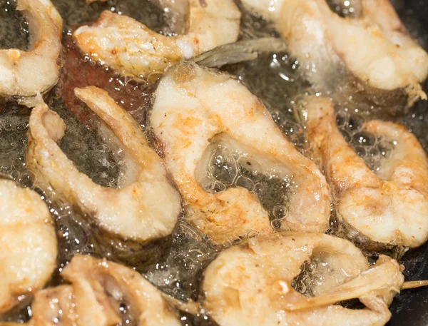 Fish is fried in a pan — Stock Photo, Image