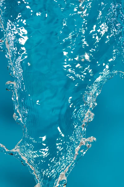 Water splash on blue background — Stock Photo, Image