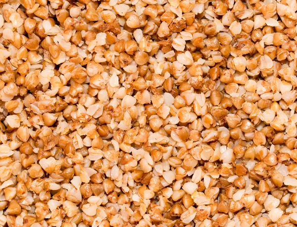 Semole di grano saraceno come sfondo. vicino — Foto Stock