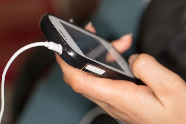 Cell phone in hand — Stock Photo, Image