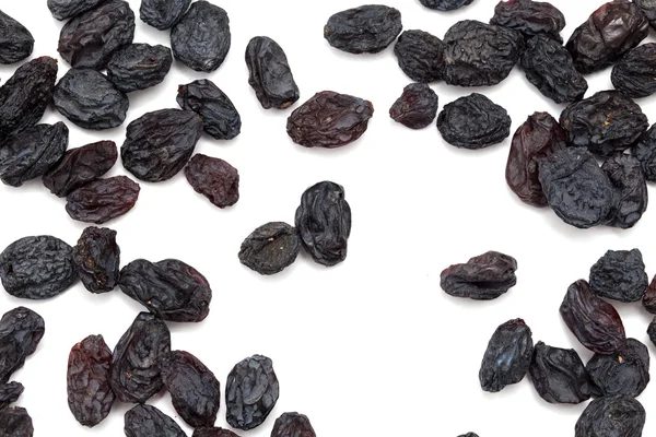 Black raisins as background. macro — Stock Photo, Image