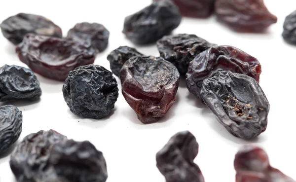 Black raisins as background. macro — Stock Photo, Image