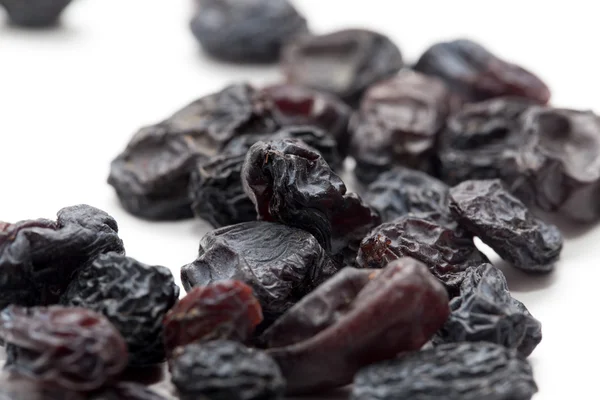 Black raisins as background. macro — Stock Photo, Image