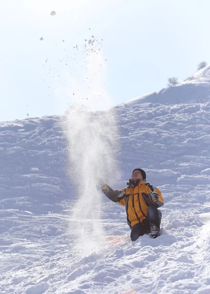 Man throws snow — Stock Photo, Image