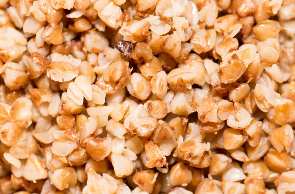 Semole di grano saraceno come sfondo. vicino — Foto Stock