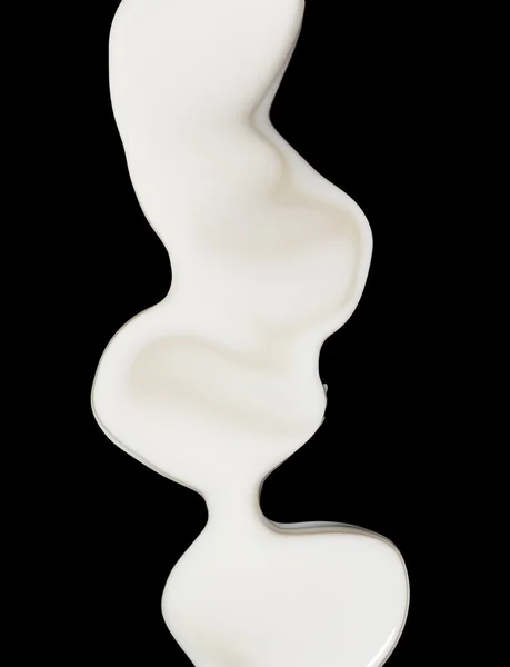 Milk splash on black background — Stock Photo, Image