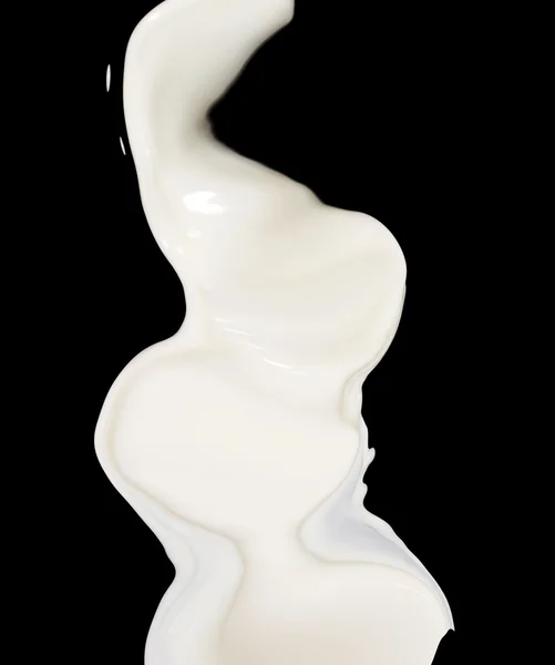 Milk splash on black background — Stock Photo, Image