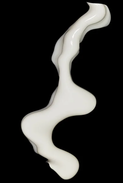 Milk splash on black background — Stock Photo, Image