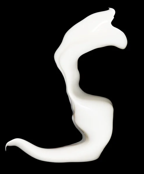 Milk splash on black background — Stock Photo, Image