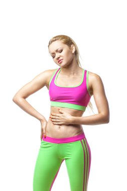Fitness woman having pain in stomach over white clipart