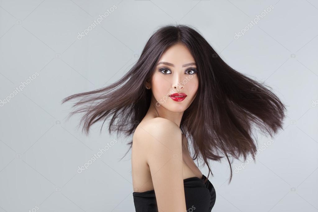 Fashion model with hair blowing in the wind in studio Stock Photo by  ©dimabl 117867550