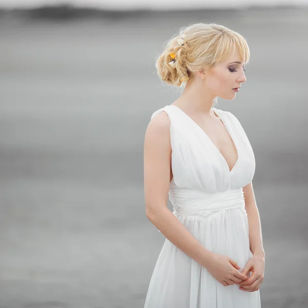 Beautiful blond woman in white dress — Stock Photo, Image