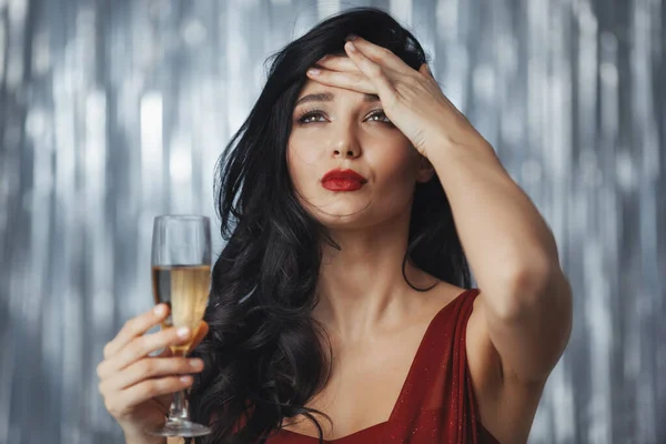 Drunk celebrating woman in red dress — Stock Photo, Image