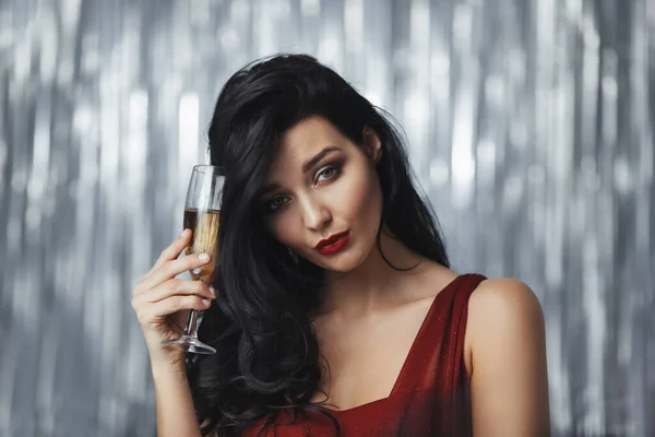 Drunk celebrating woman in red dress — Stock Photo, Image