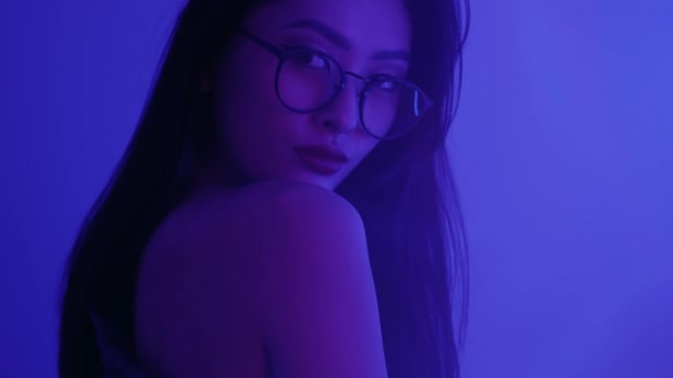 Studio Portrait of Asian Woman with Neon Lights. — Stock Video
