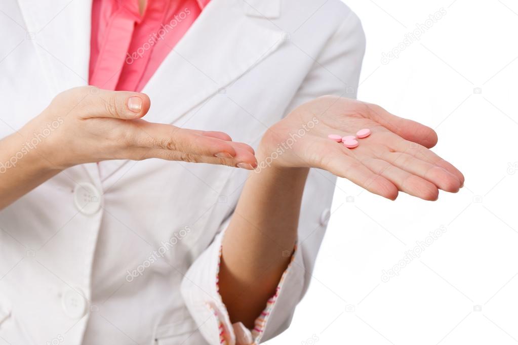 Medicines in hand close-up.