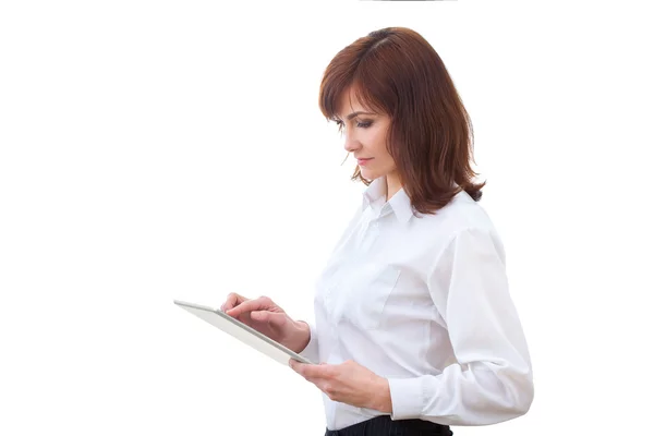 Adult female in shirt using tablet — Stock Photo, Image