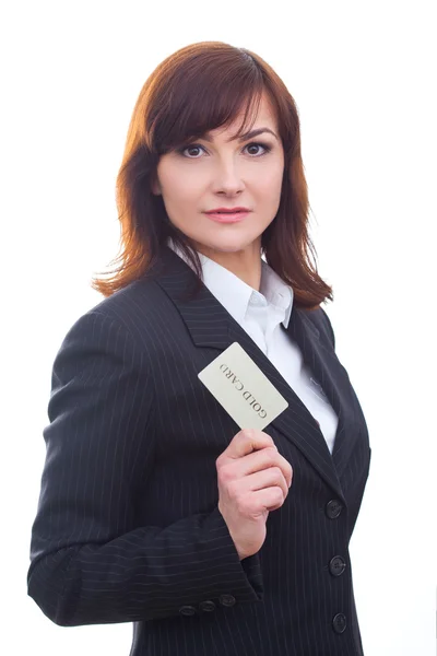 Happy beautiful businesswoman holding a gold card — Stock Photo, Image