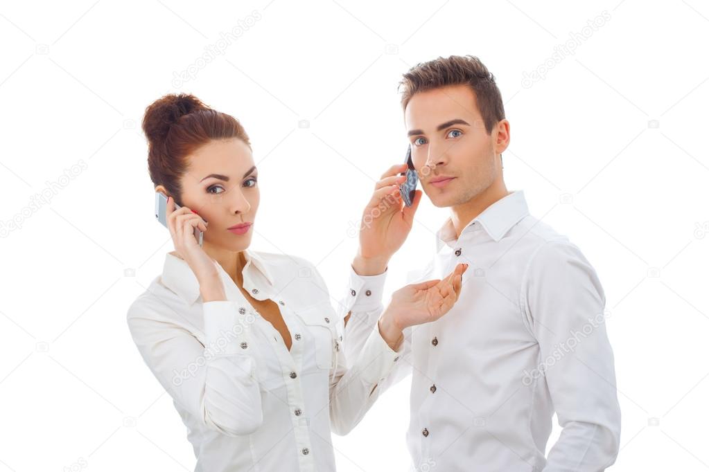 Young couple talking on mobile phone