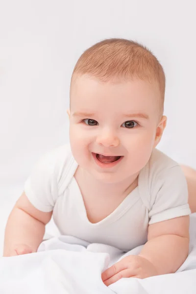 Cute smiling baby boy on white background Stock Image
