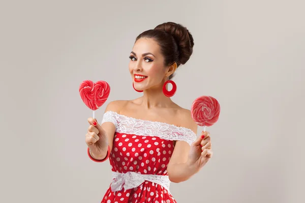 Happy Woman Holding Two Red Lollipops. Pin-up stile retrò . — Foto Stock