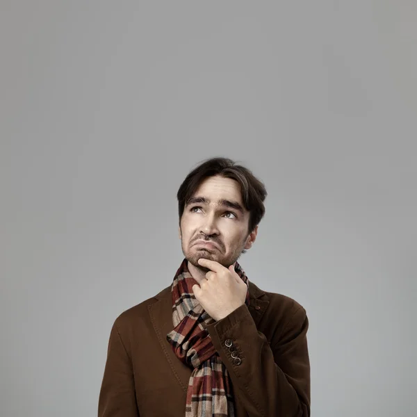 Hipster style thinking man in studio — Stock Photo, Image