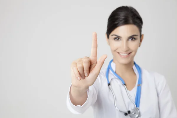 Uma médica sorridente. Foco na mão — Fotografia de Stock
