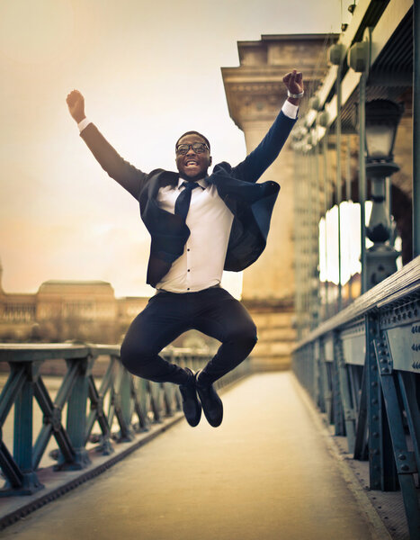 Happy businessman jumping