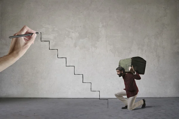 Strong man climbing the stairs — Stock Photo, Image