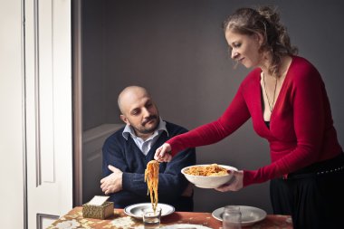 Woman serving spaghetti clipart