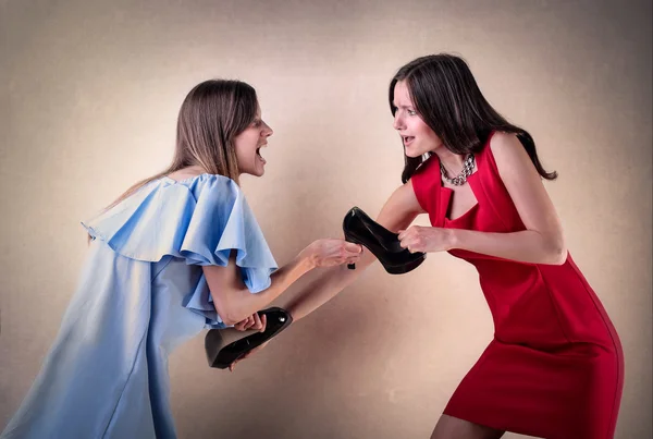 Women arguing about shoes — Stock Photo, Image