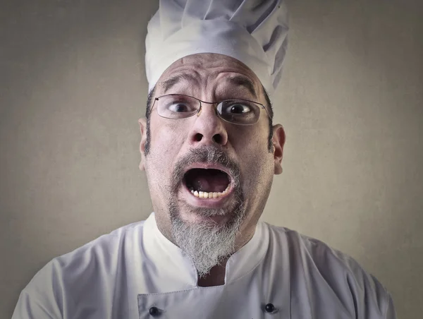 Verbaasd chef-kok met open mond — Stockfoto