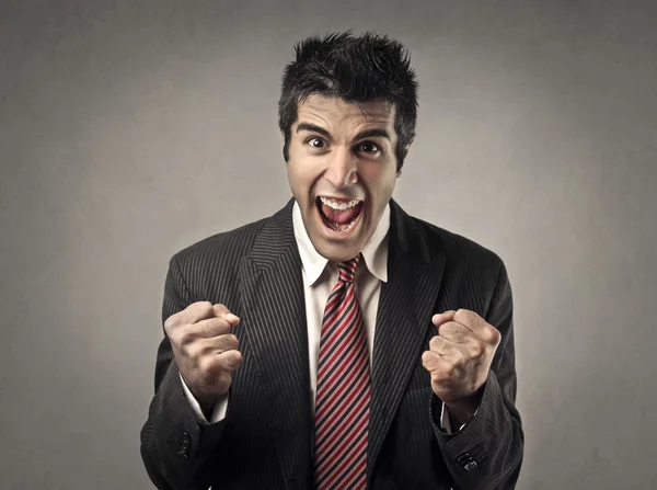 Счастливый бизнесмен кричит — стоковое фото