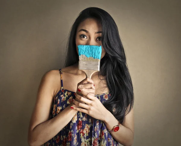 Woman painting blue — Stock Photo, Image