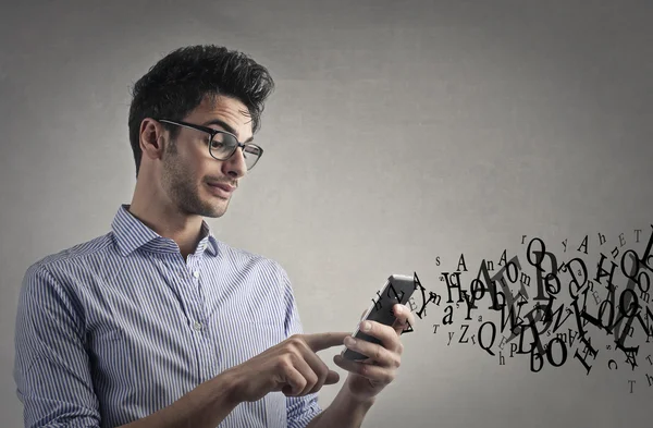 Man texting on his phone — Stock Photo, Image