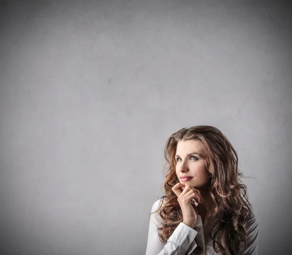 Businesswoman thinking of something — Stock Photo, Image