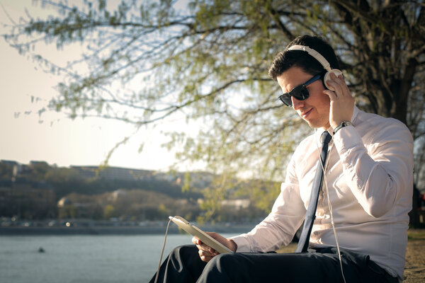 Businessman listening to music