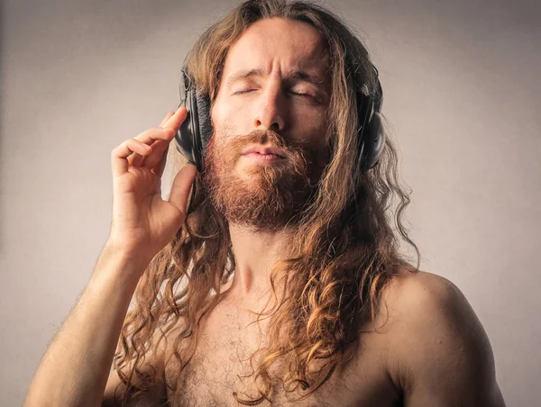 Bearded man listening to music — Stock Photo, Image