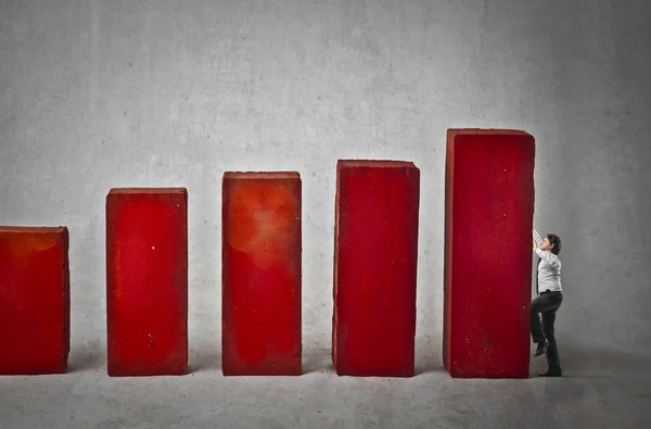 Businessman climbing a graph — Stock Photo, Image