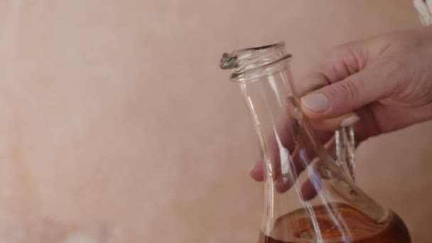 Woman Pours Argan Oil Glass Bowl Pure Authentic Organic Argan — Vídeo de stock