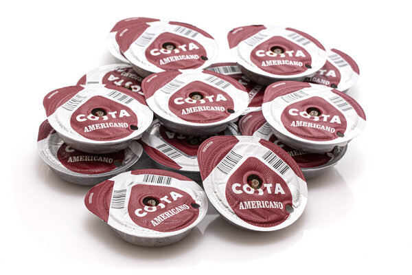 SWINDON, UK - JANUARY 2, 2021:  Pile of used Costa Americano Coffee pods on a white background. 