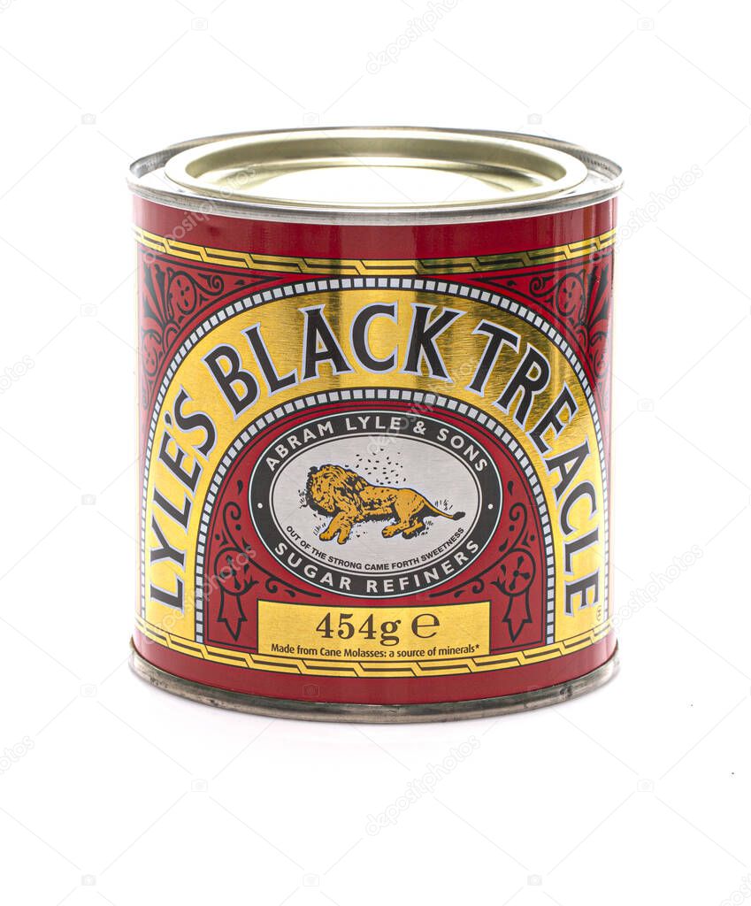 SWINDON, UK - JANUARY 5, 2021:  Tin of Lyles Black Treacle on a white background