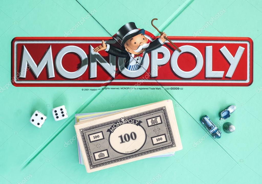 SWINDON, UK - JUNE 11, 2014: English Edition of Monopoly showing The Logo,  The classic trading game from Hasbro was first introduced to America in 1935.