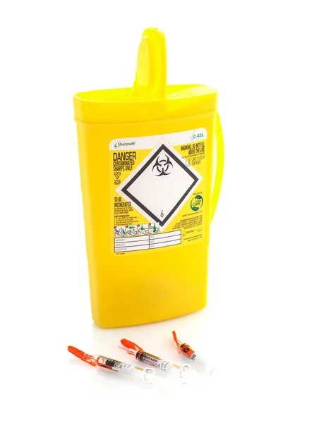 Yellow medical sharps disposal box on a White Background — Stock Photo, Image