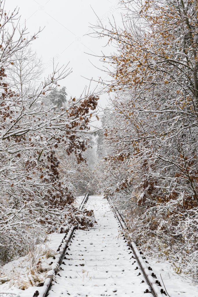 snowy canceled old railway track