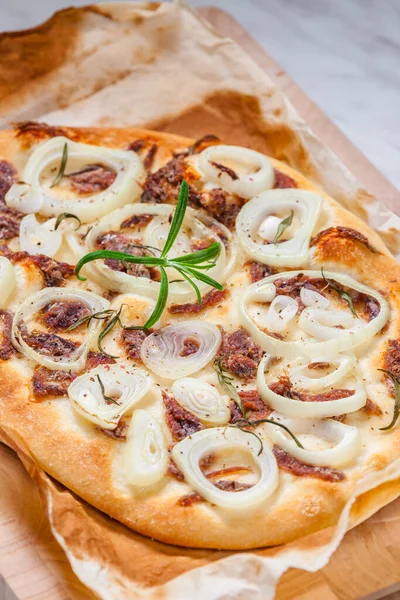 homemade pizza with anchovies and onion